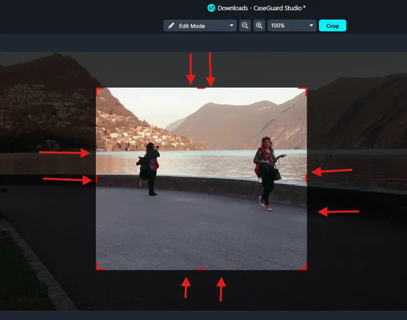 cropped 1 | CaseGuard Crop tool interface showing a photo of two people by a lakeside, with red crop handles and arrows indicating the adjustable crop area.