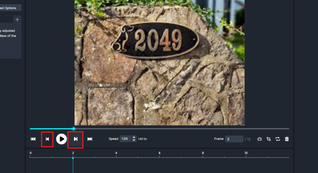 Stone wall with a black oval plaque showing the gold number 2049, set among rocks and greenery
