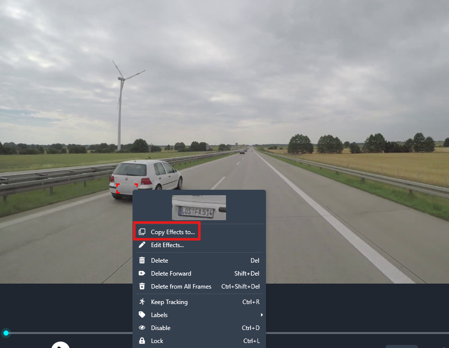 copy-effects | CaseGuard Highway scene with a white car on the left, wind turbine in the distance, and a video editor menu reading 'Copy Effects to…' in the foreground.