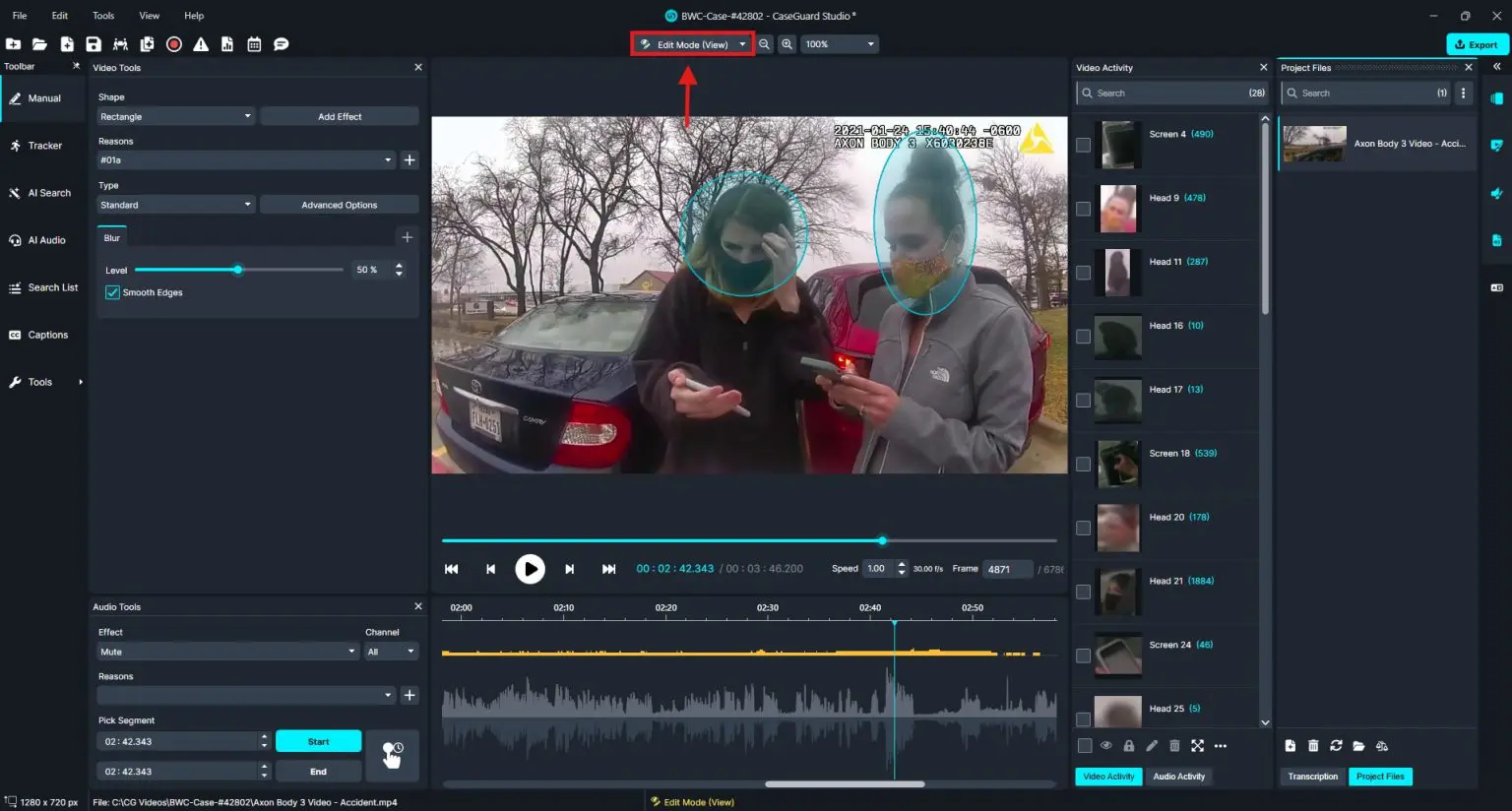 Screen capture of video editing software in Edit Mode, showing two people on a parking lot video with facial blur circles applied.