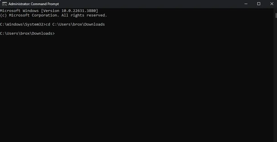 Windows Command Prompt window showing a prompt from C:WindowsSystem32: the user types 'cd C:UsersbroxDownloads' and then returns to C:UsersbroxDownloads> indicating a directory change.