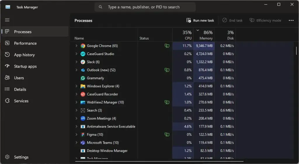 Windows Task Manager in dark theme showing the Processes tab with a list of apps and per-process CPU, memory, and disk usage bars/figures.