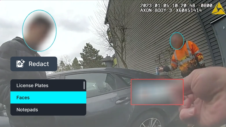 Bodycam frame showing two blurred individuals circled, a person in an orange vest near a car, with a redacted license plate area and on-screen redact options (Faces, License Plates).