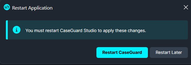 Dialog prompting to restart the CaseGuard Studio app to apply changes, with buttons 'Restart CaseGuard' (highlighted) and 'Restart Later'